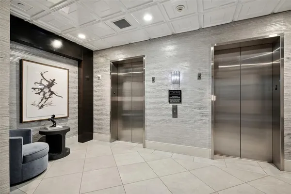 a spacious bathroom with a glass door shower and a sink