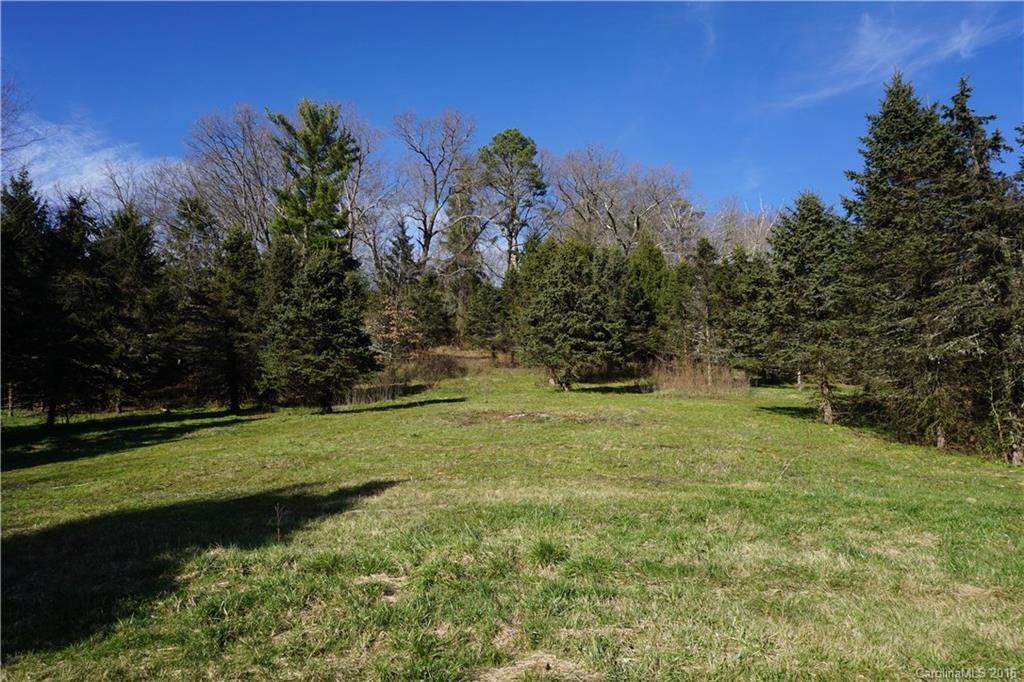 0 County Road Waynesville, NC 28785 - Photo 7 of 13 a view of a grassy field with trees