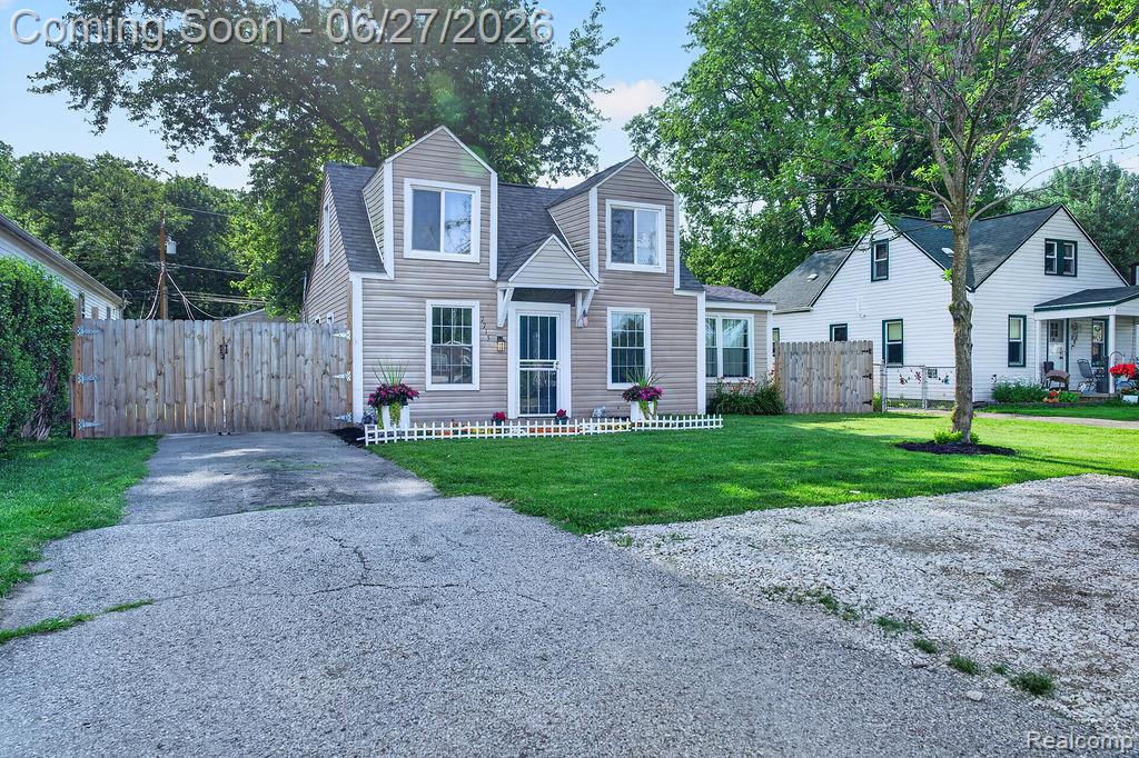 7715 Beech Daly Road Taylor, MI 48180 - Photo 3 of 21 Light-toned siding exterior with white trim windows and a dark roof