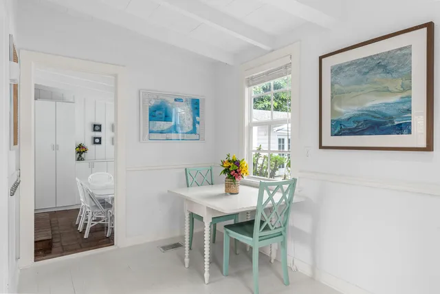 a bedroom with furniture and wooden floor