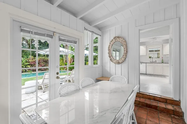 a spacious bedroom with a bed and a window