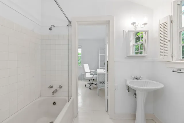 a bedroom with a bed and a television