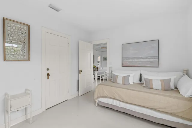 a view of house with backyard and outdoor seating