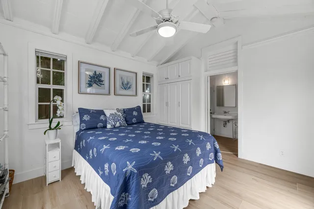 a view of a patio with table and chairs and potted plants