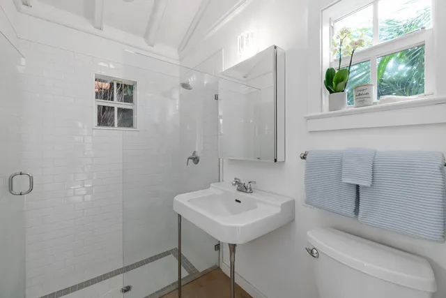 a view of backyard with seating area and green space