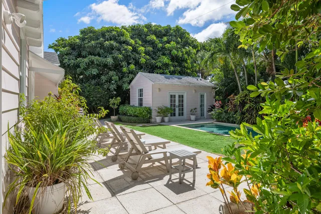 a view of a house with a yard porch and sitting area