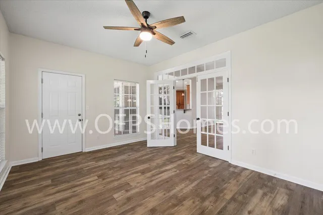 a view of a livingroom with wooden floor