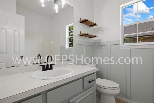 a bathroom with a sink and a toilet