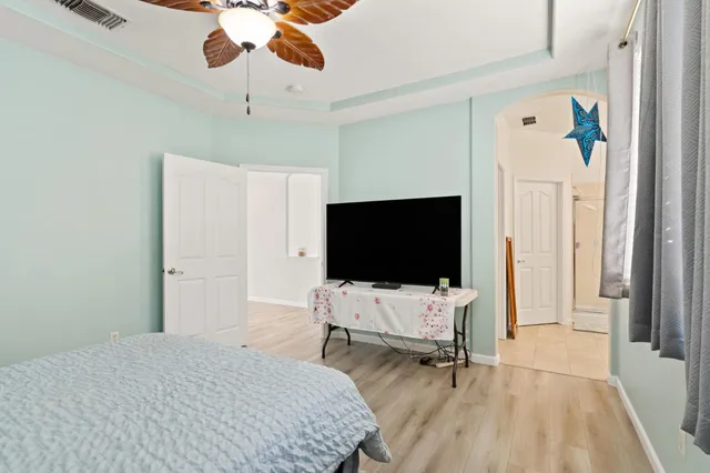 a bedroom with bed and tv