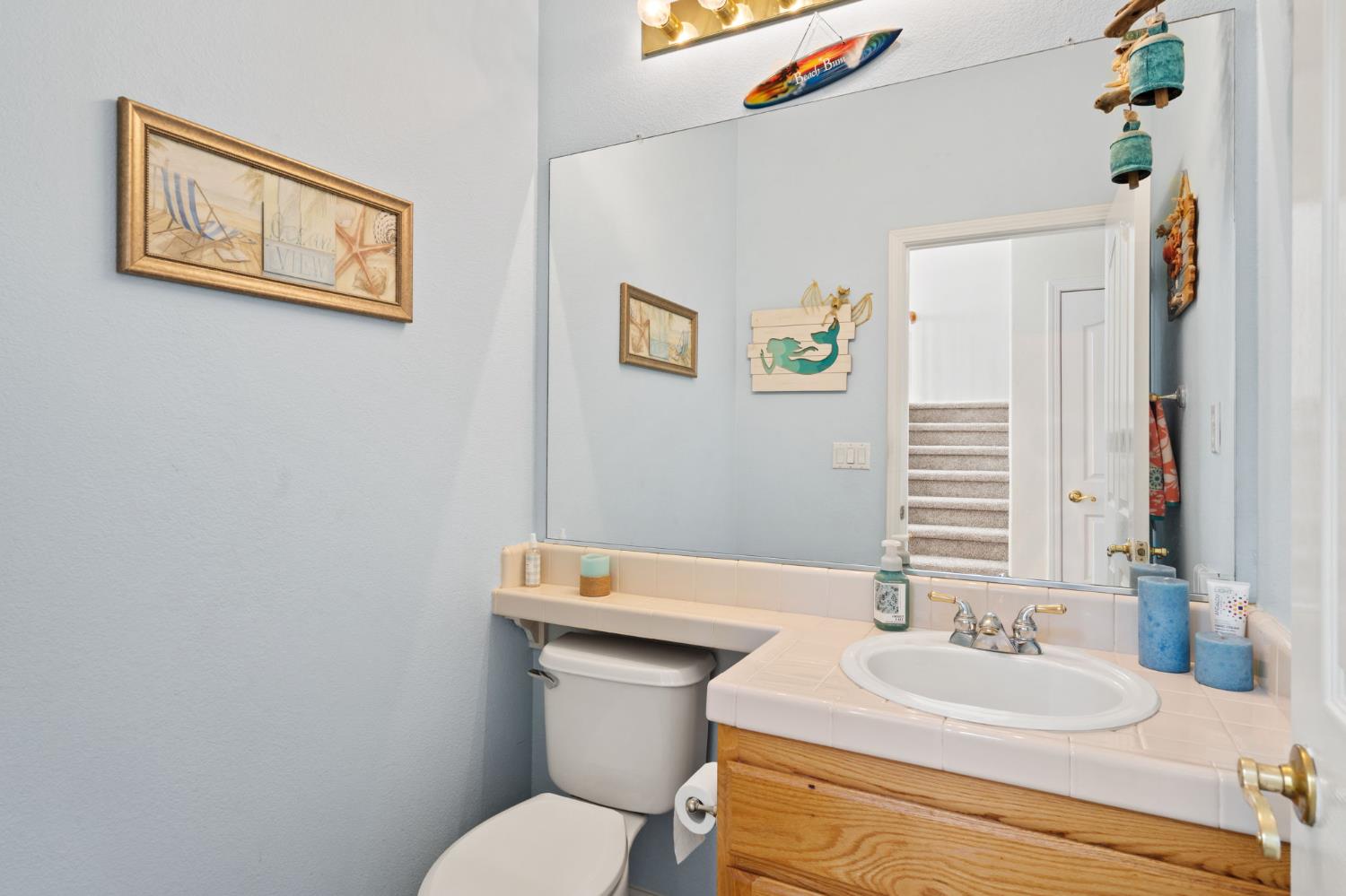 46 Bascom Court Sacramento, CA 95835 - Photo 22 of 34 a bathroom with a toilet a sink and a mirror