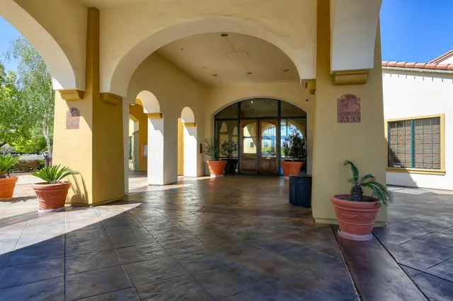 a lobby with a table and chair