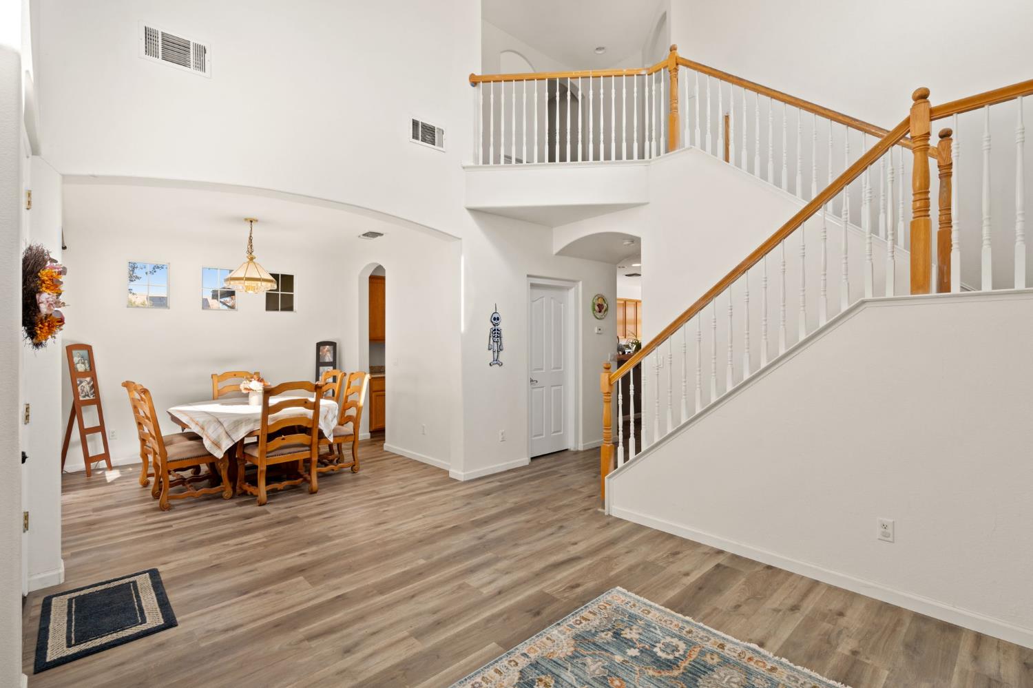 46 Bascom Court Sacramento, CA 95835 - Photo 6 of 34 a view of a livingroom with wooden floor and stairs