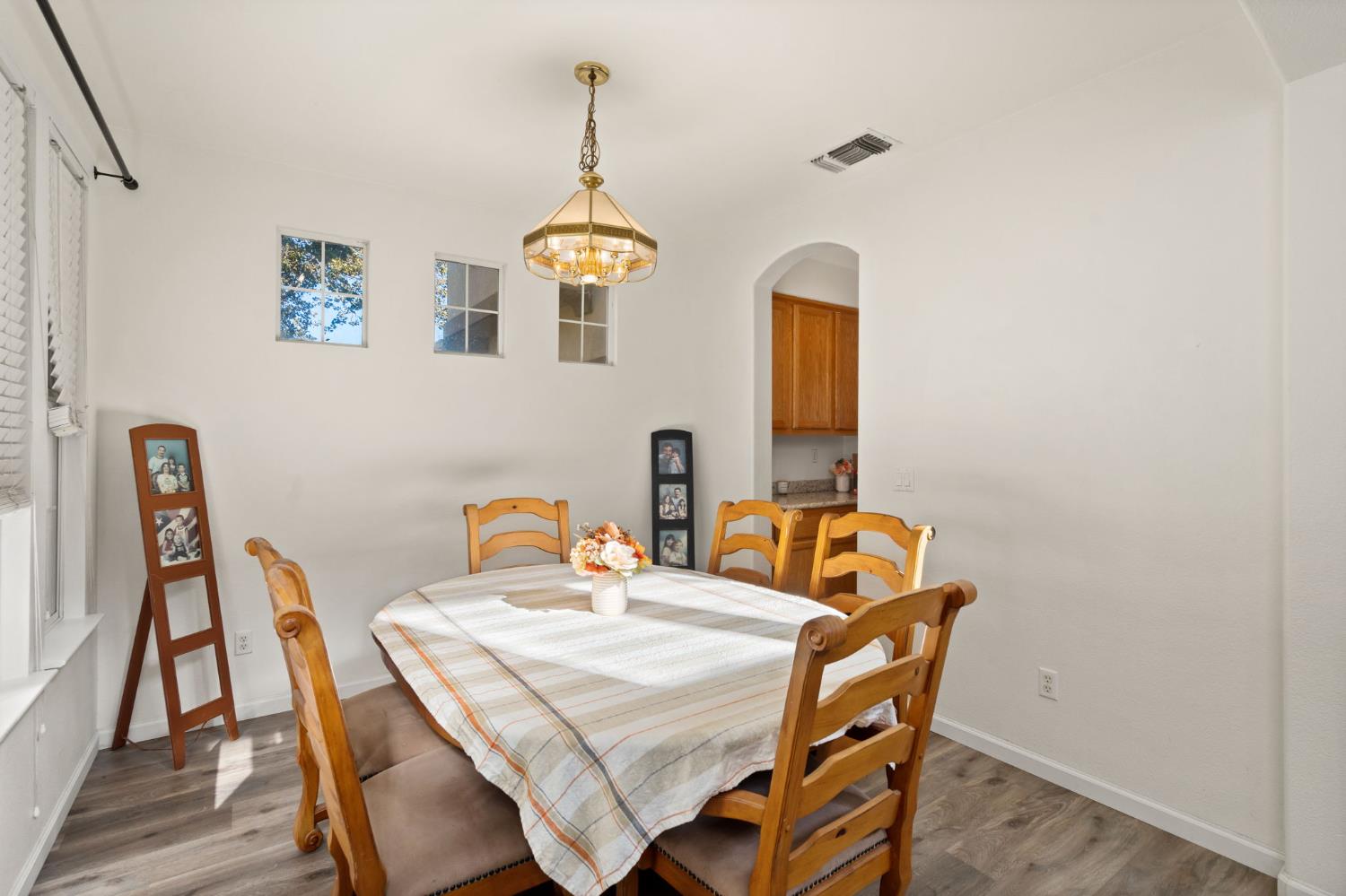 46 Bascom Court Sacramento, CA 95835 - Photo 7 of 34 a dining room with furniture and wooden floor