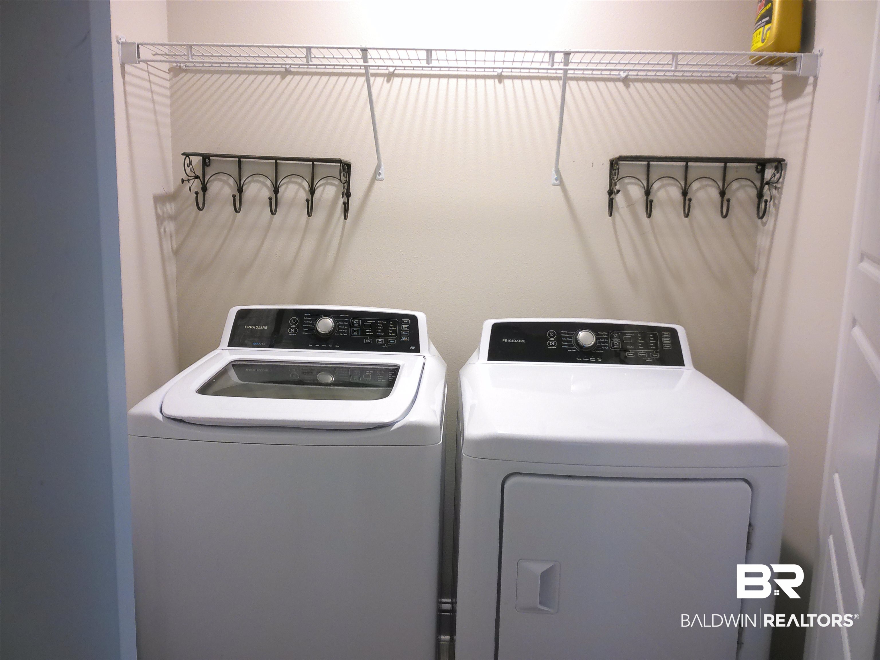 25806 Pollard Road, Unit 23 Daphne, AL 36526 - Photo 12 of 16 Laundry area featuring washer and clothes dryer