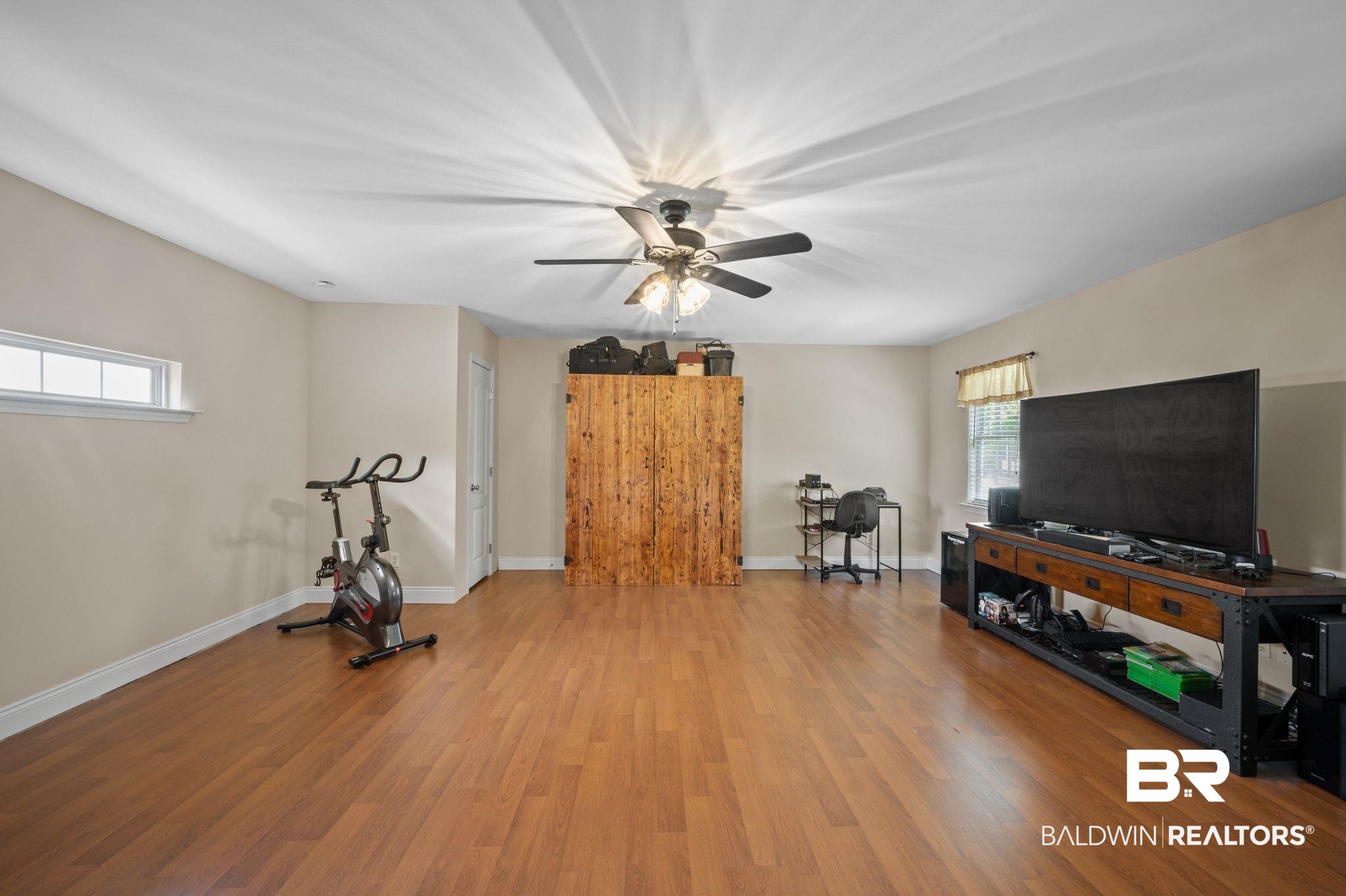 48513 Phillipsville Road Bay Minette, AL 36507 - Photo 18 of 50 Exercise area featuring wood finished floors and ceiling fan