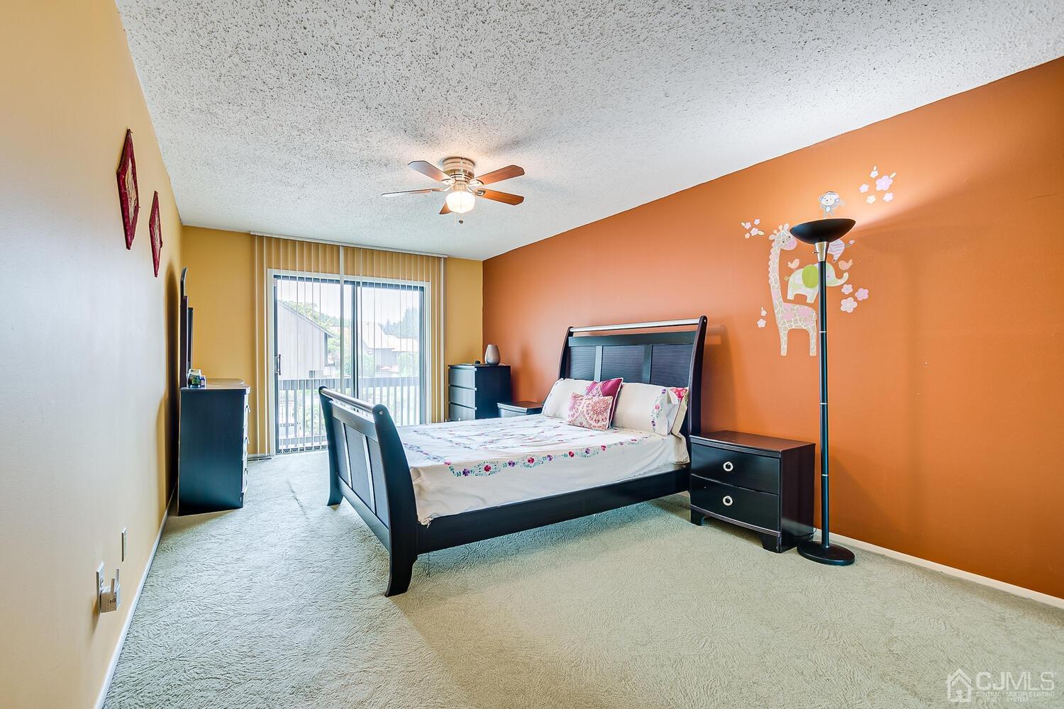 564 Westgate Drive Edison, NJ 08820 - Photo 17 of 37 a bedroom with a bed and a chandelier