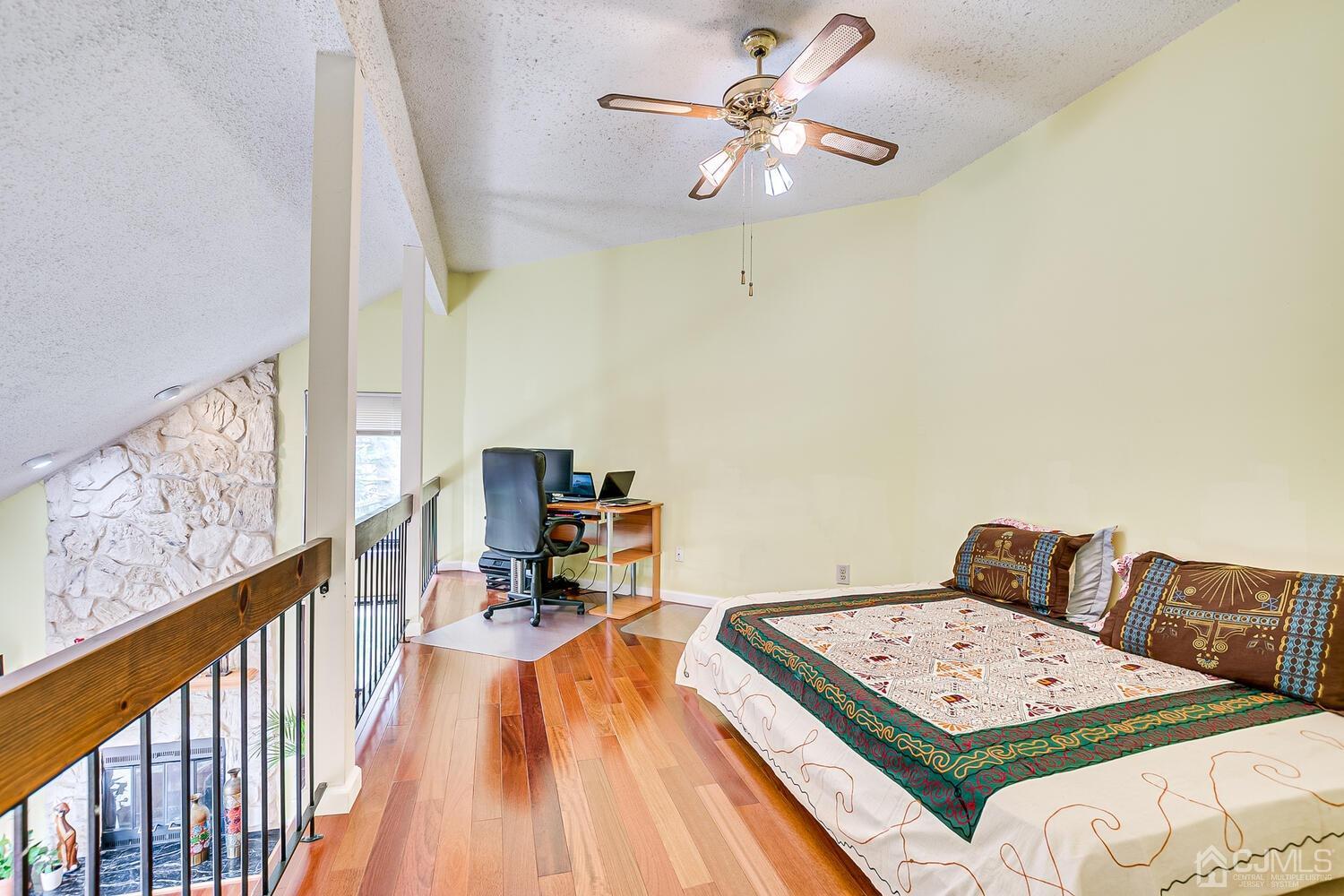 564 Westgate Drive Edison, NJ 08820 - Photo 20 of 37 a living room with furniture and a chandelier