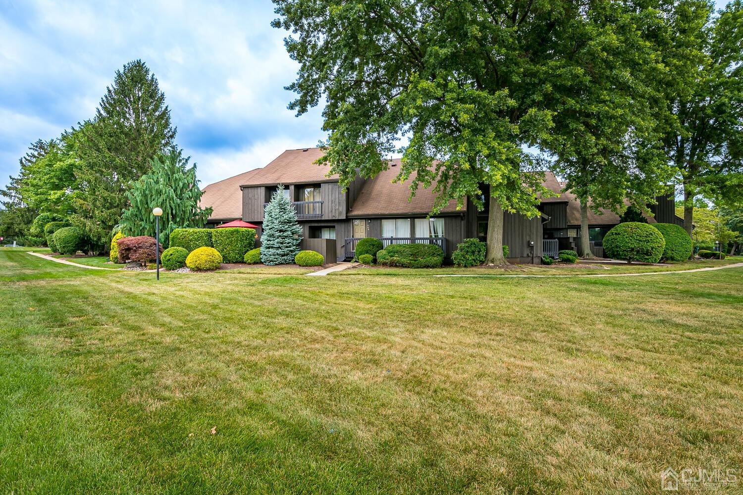 564 Westgate Drive Edison, NJ 08820 - Photo 2 of 37 a front view of a house with garden
