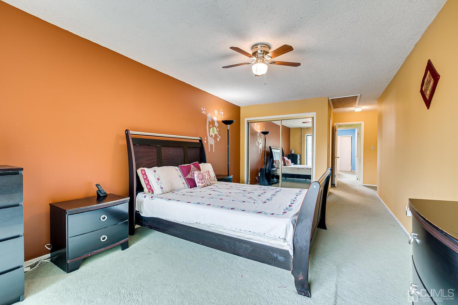 564 Westgate Drive Edison, NJ 08820 - Photo 21 of 37 a bedroom with a bed and wooden floor