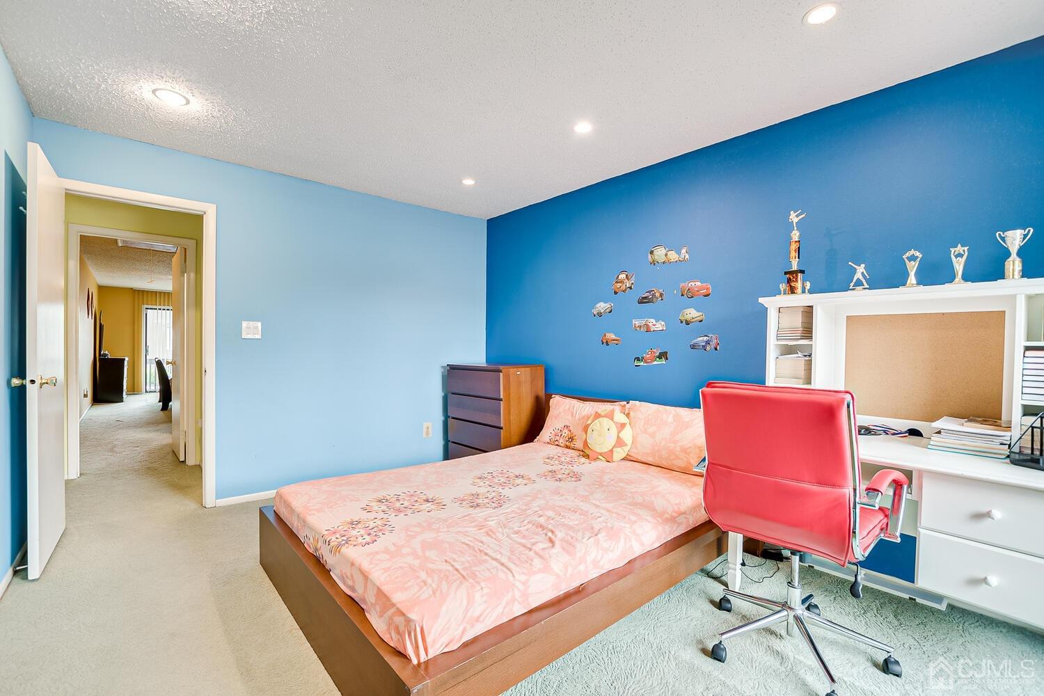 564 Westgate Drive Edison, NJ 08820 - Photo 24 of 37 a bedroom with a bed and a workspace
