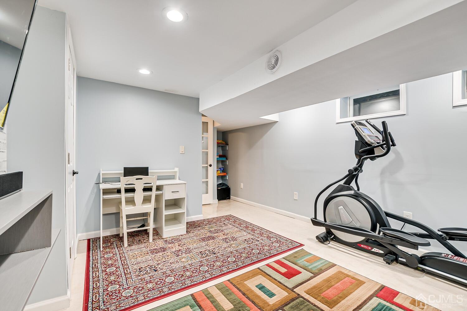 564 Westgate Drive Edison, NJ 08820 - Photo 28 of 37 a room with a chair and white walls