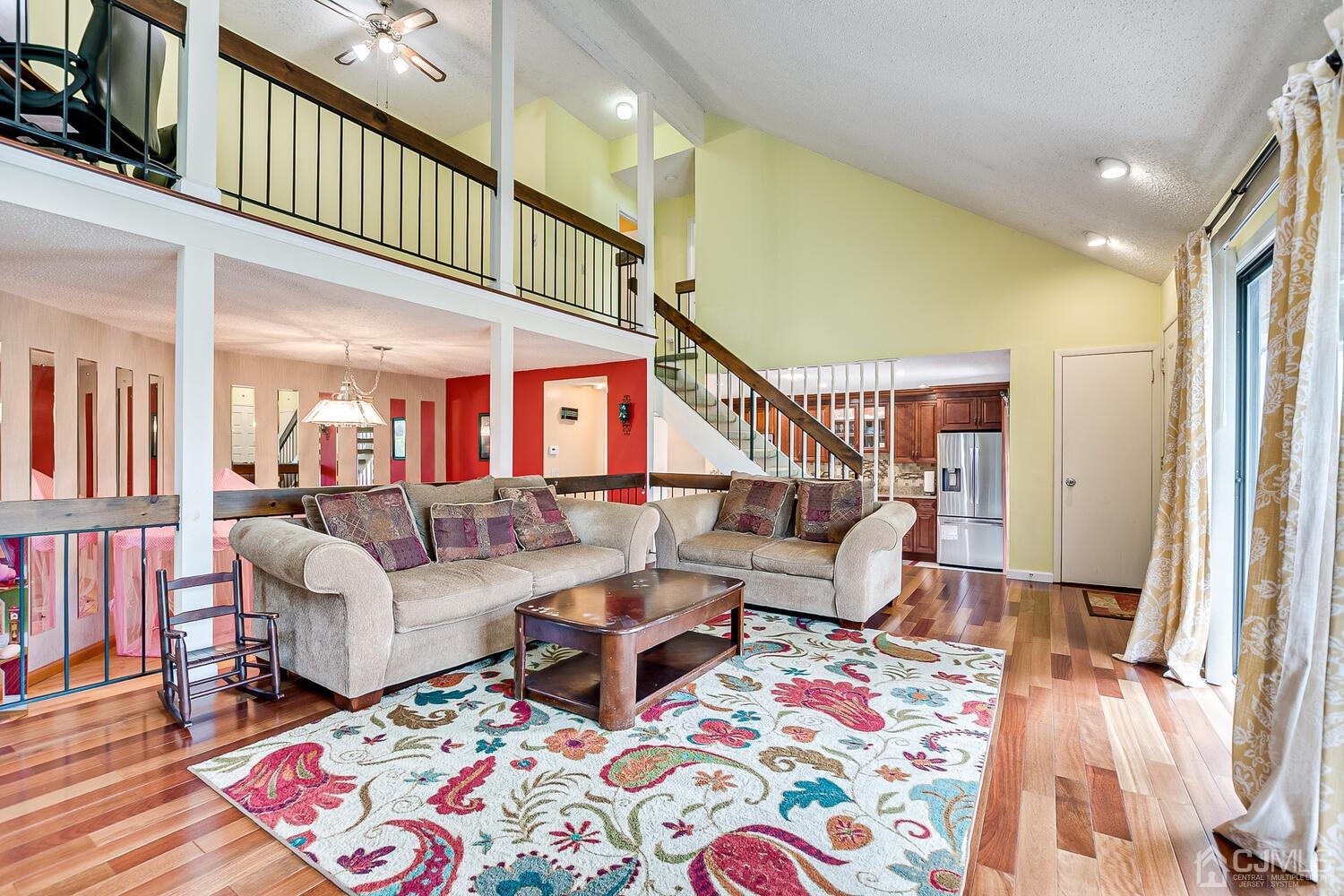 564 Westgate Drive Edison, NJ 08820 - Photo 5 of 37 a living room with fireplace furniture and a rug