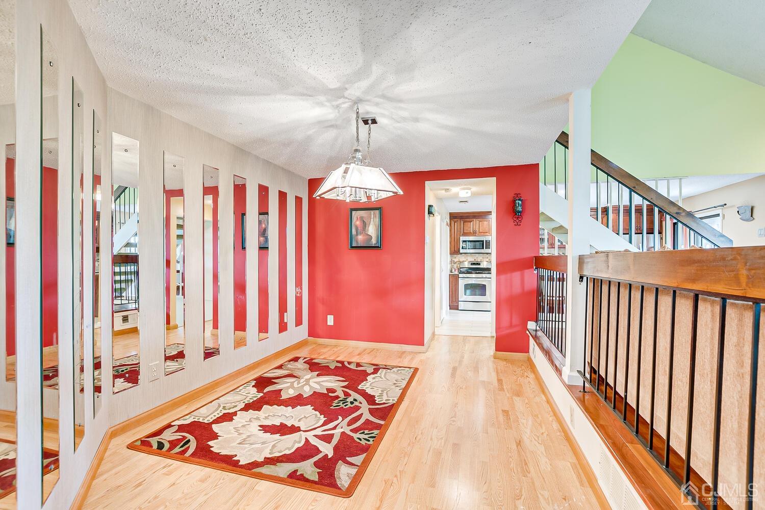564 Westgate Drive Edison, NJ 08820 - Photo 10 of 37 a view of a bedroom with wooden floor and windows