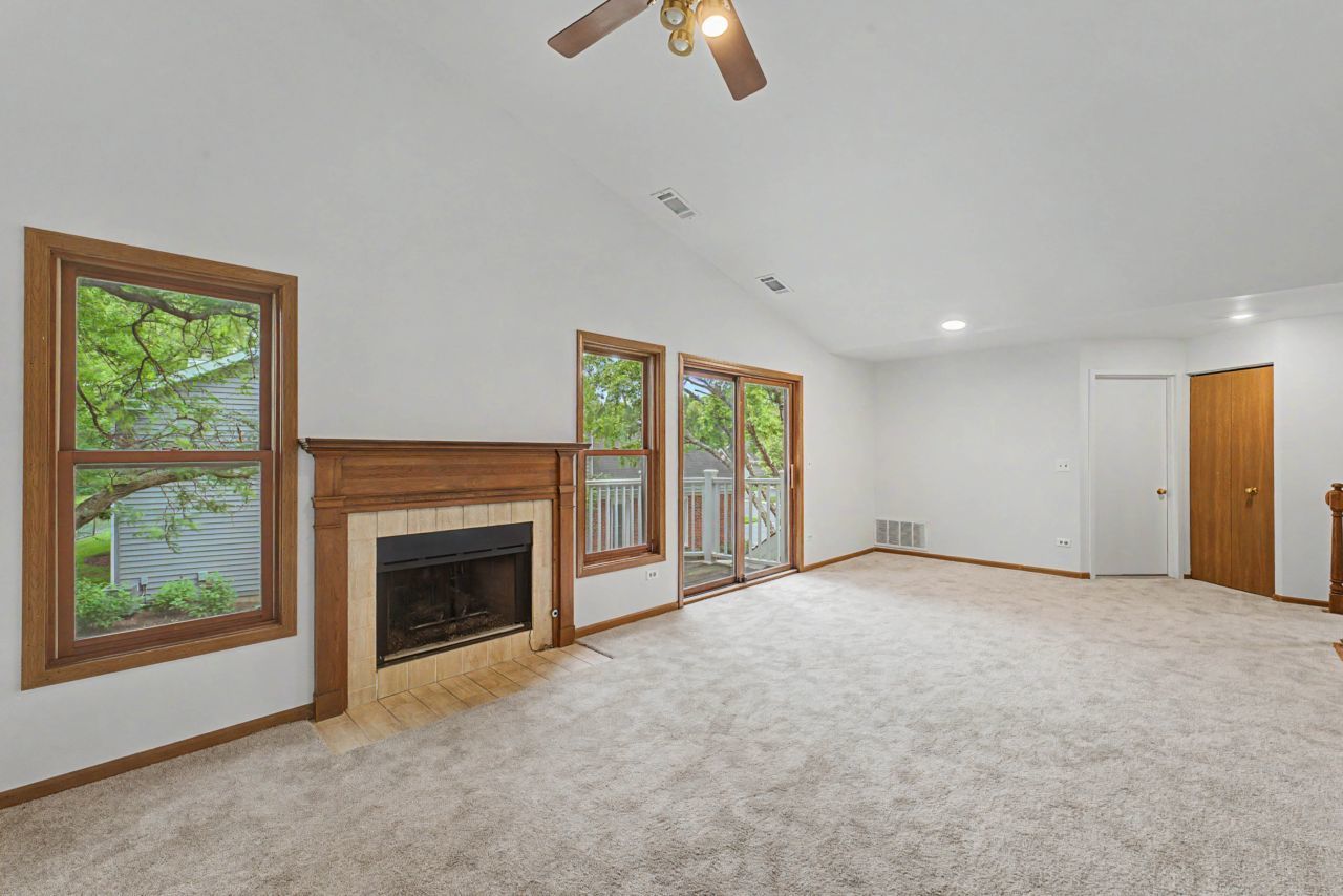 1953 North Coldspring Road Arlington Heights, IL 60004 - Photo 9 of 27 a view of an empty room with window and fire place