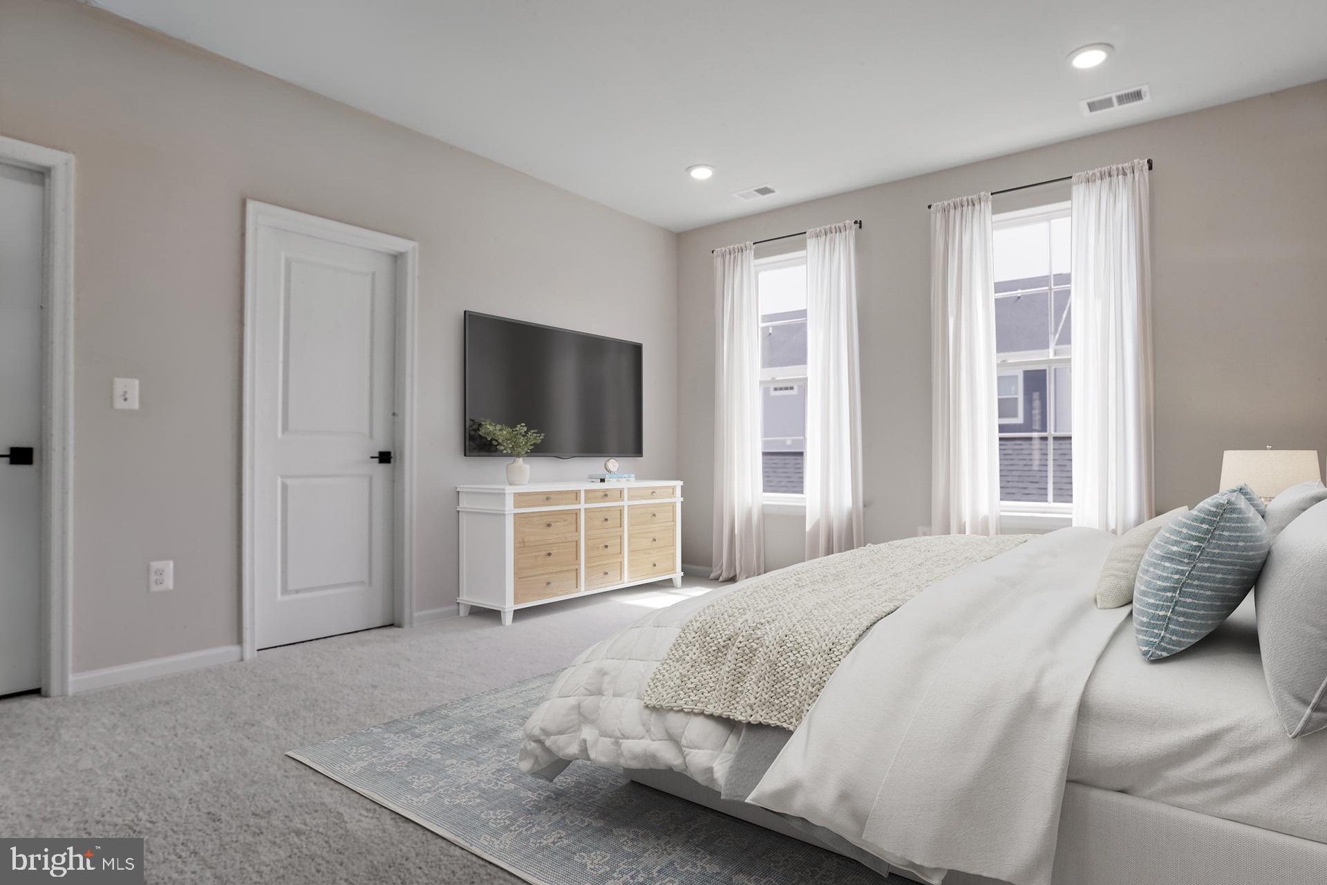 3-c 0003 Greenleigh Avenue Middle River, MD 21220 - Photo 13 of 16 a bedroom with a bed and a flat screen tv