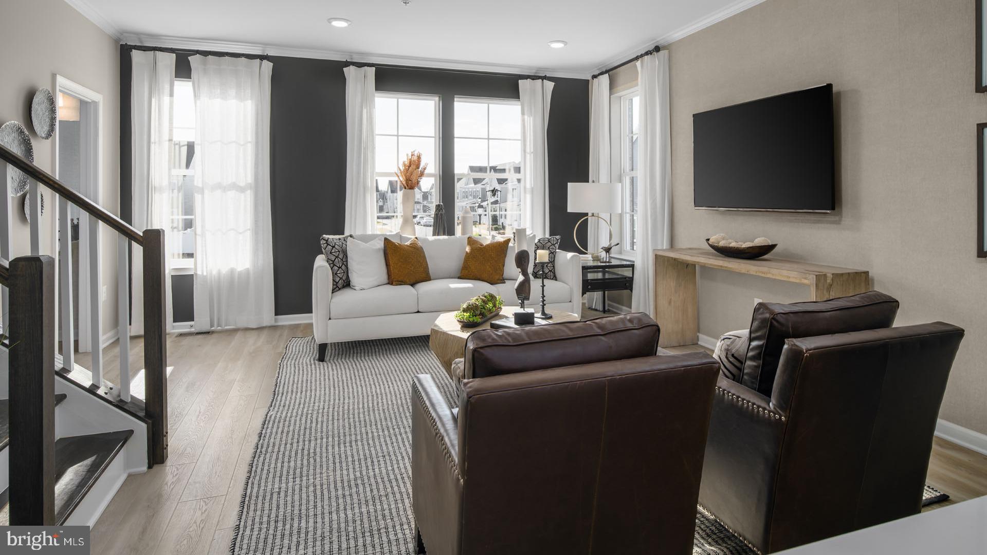 3-c 0003 Greenleigh Avenue Middle River, MD 21220 - Photo 5 of 16 a living room with furniture and a flat screen tv