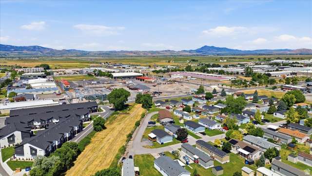 433 North 750 West Logan, UT 84321 - Photo 39 of 40 Expansive aerial perspective showcasing a mixed-use area with residential and commercial structures