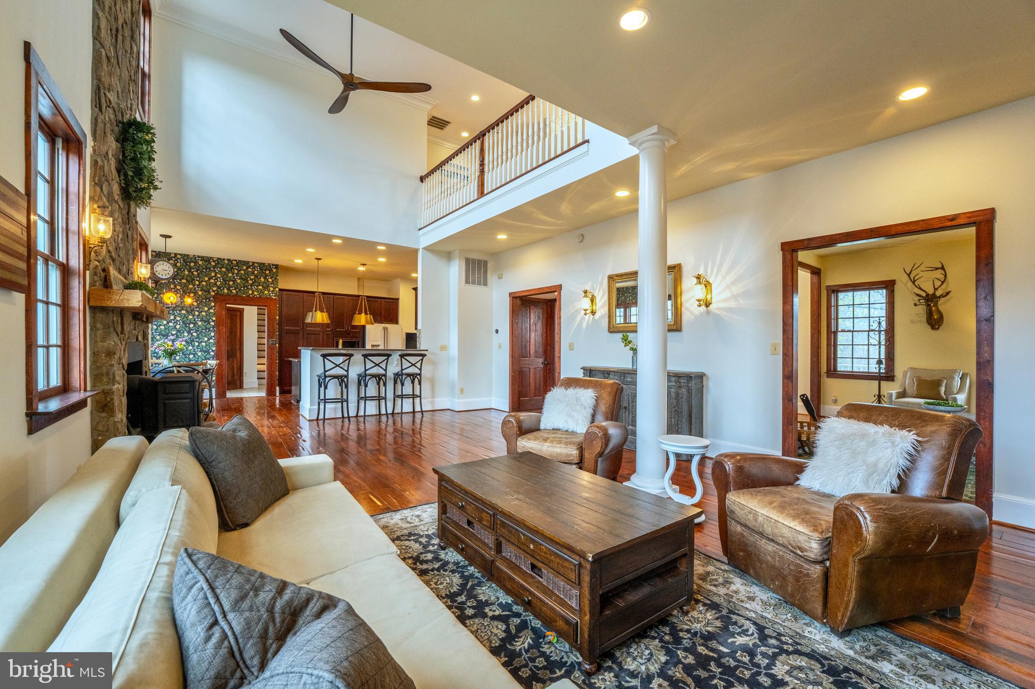 15718 Old Waterford Road Waterford, VA 20197 - Photo 12 of 81 a living room with furniture a rug and a chandelier