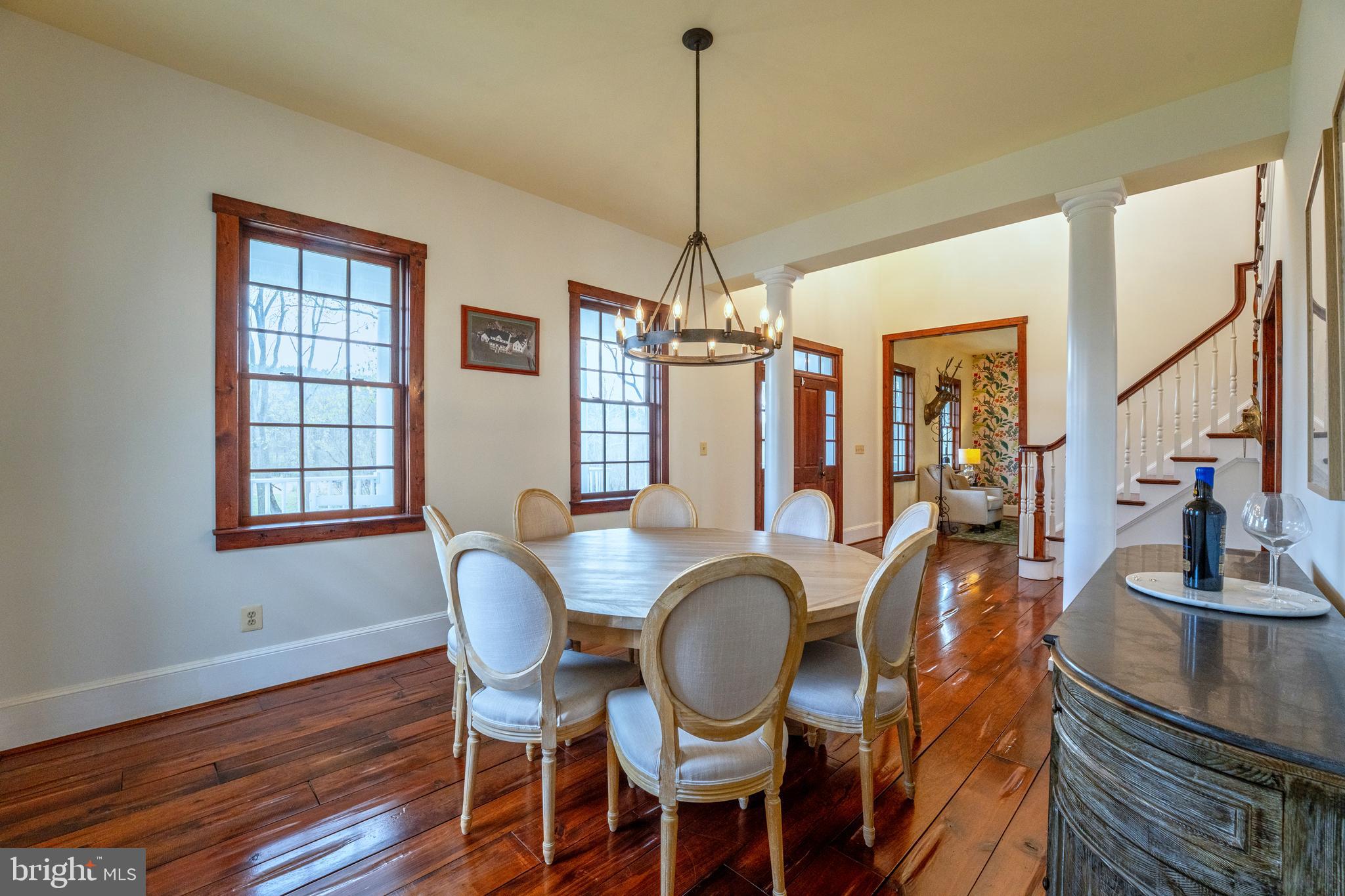15718 Old Waterford Road Waterford, VA 20197 - Photo 16 of 81 a dining room with furniture a chandelier and wooden floor