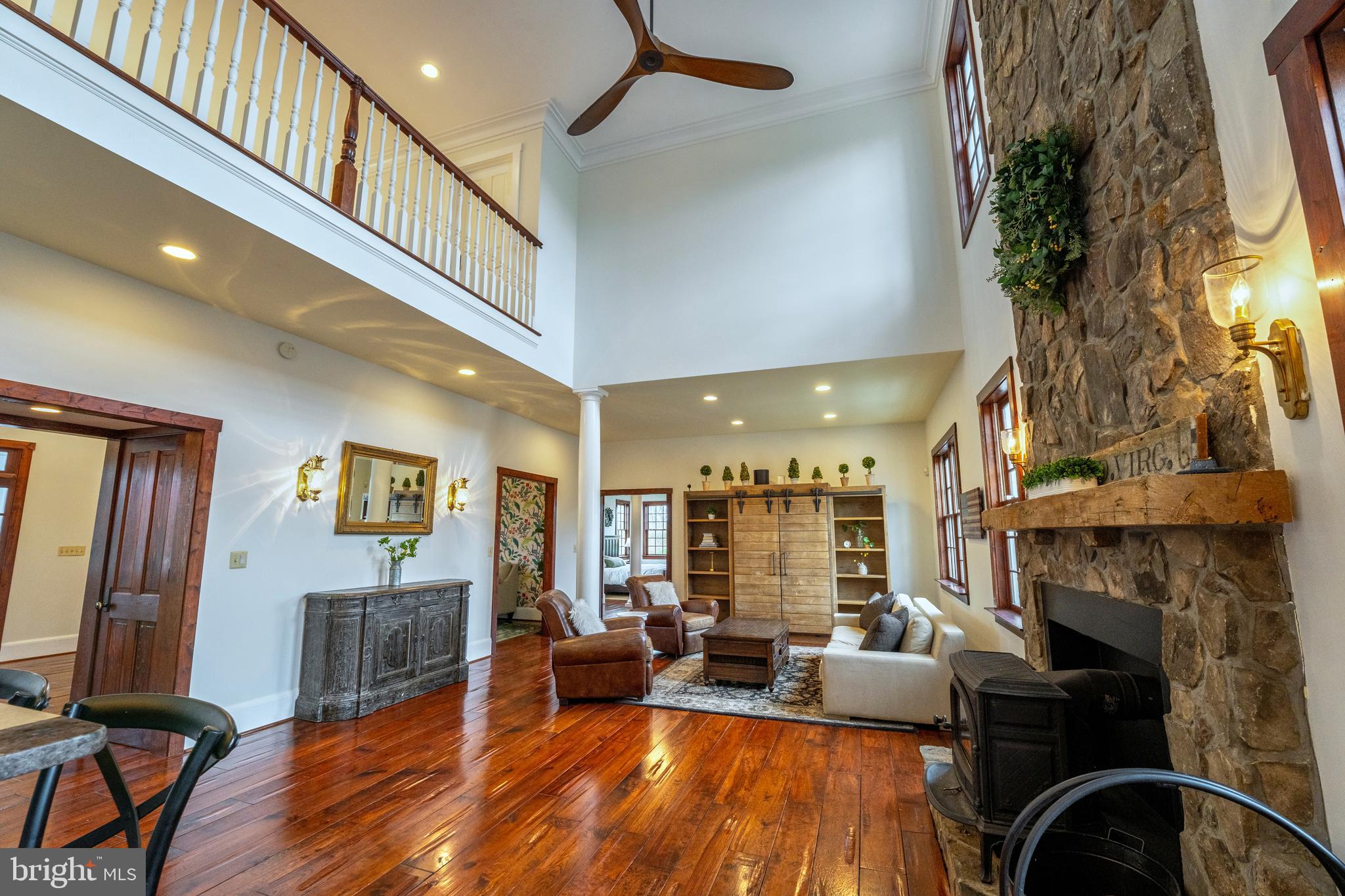 15718 Old Waterford Road Waterford, VA 20197 - Photo 21 of 81 a living room with furniture a fireplace and a potted plant