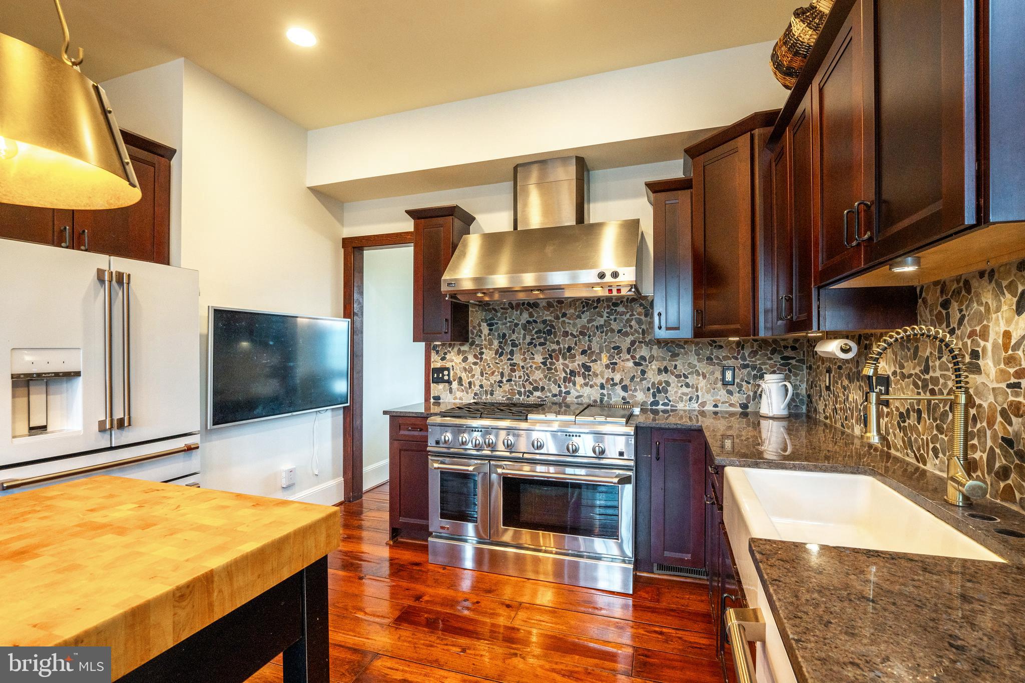 15718 Old Waterford Road Waterford, VA 20197 - Photo 27 of 81 a kitchen with stainless steel appliances granite countertop a sink and a stove