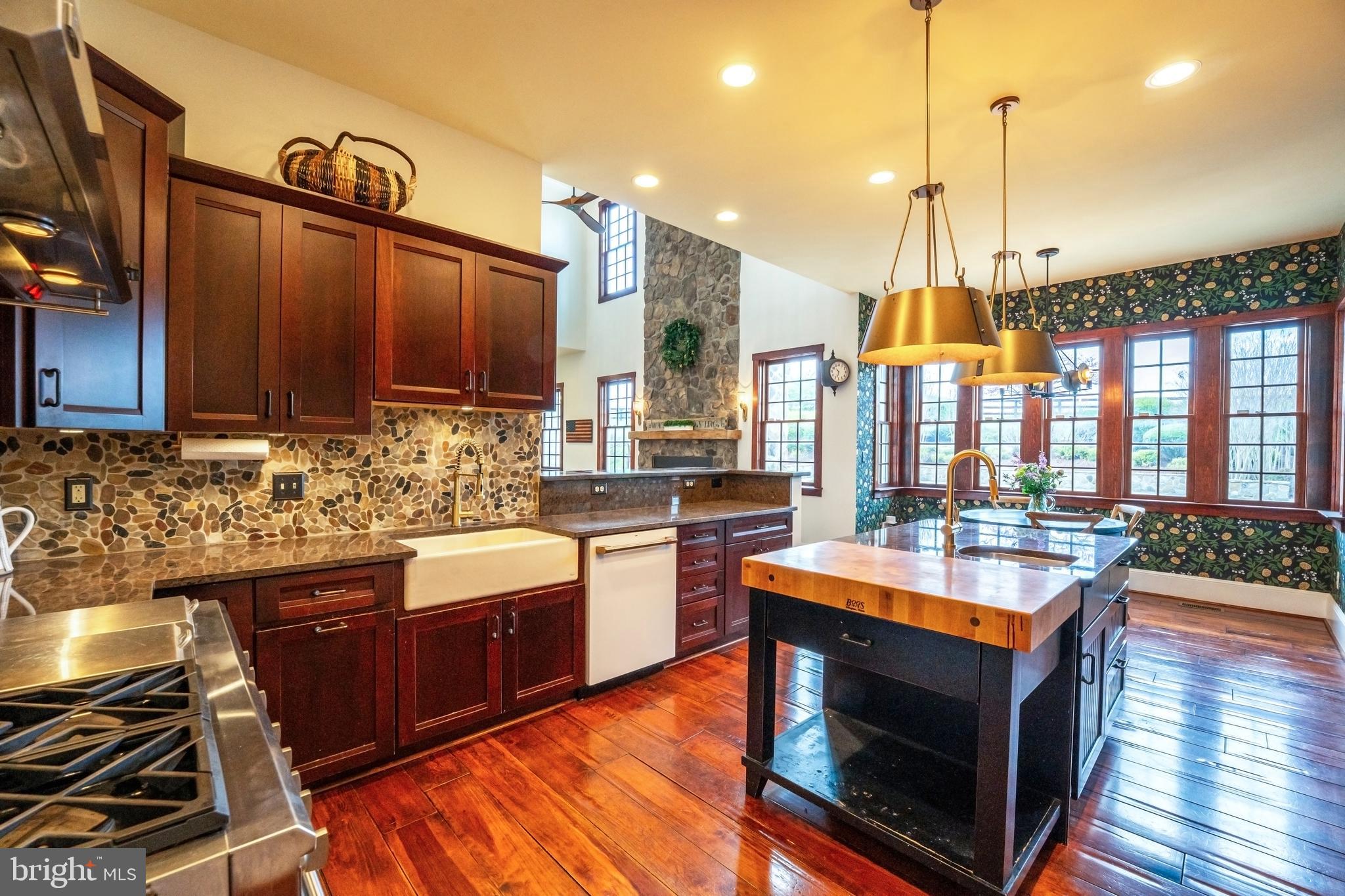 15718 Old Waterford Road Waterford, VA 20197 - Photo 28 of 81 a kitchen with stainless steel appliances granite countertop a stove a sink and a wooden floors