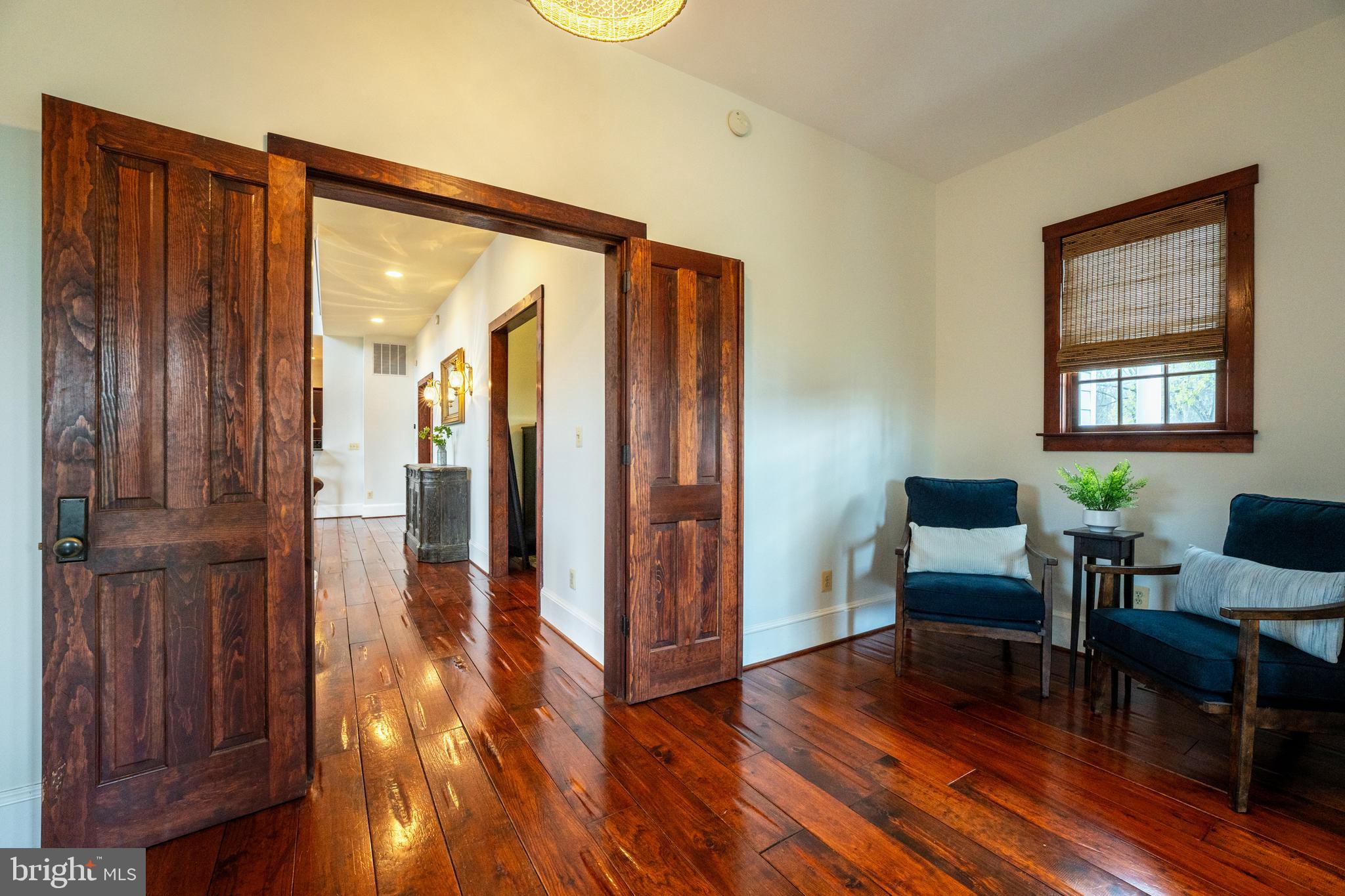 15718 Old Waterford Road Waterford, VA 20197 - Photo 31 of 81 a view of a hallway with wooden floor and furniture