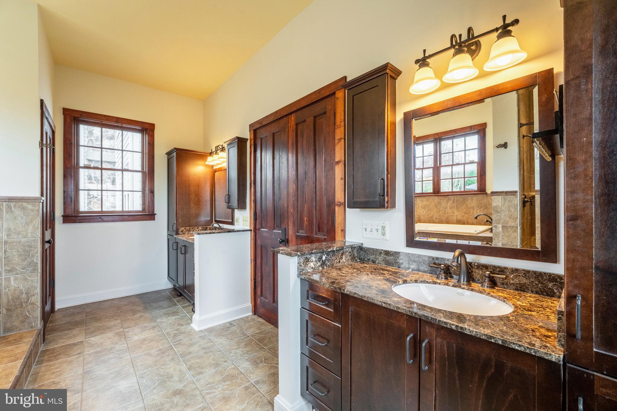 15718 Old Waterford Road Waterford, VA 20197 - Photo 37 of 81 a bathroom with a granite countertop sink and a mirror