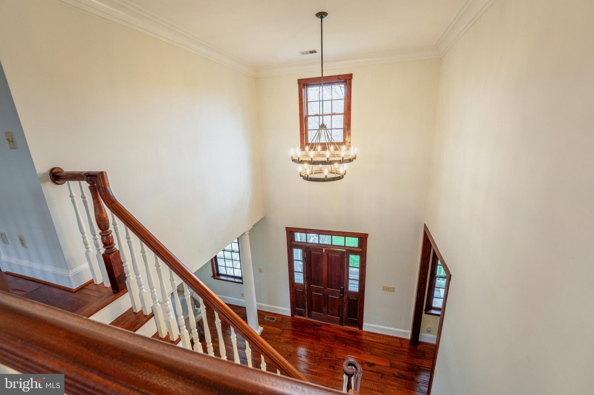 15718 Old Waterford Road Waterford, VA 20197 - Photo 39 of 81 a view of a hallway with wooden floor and stairs