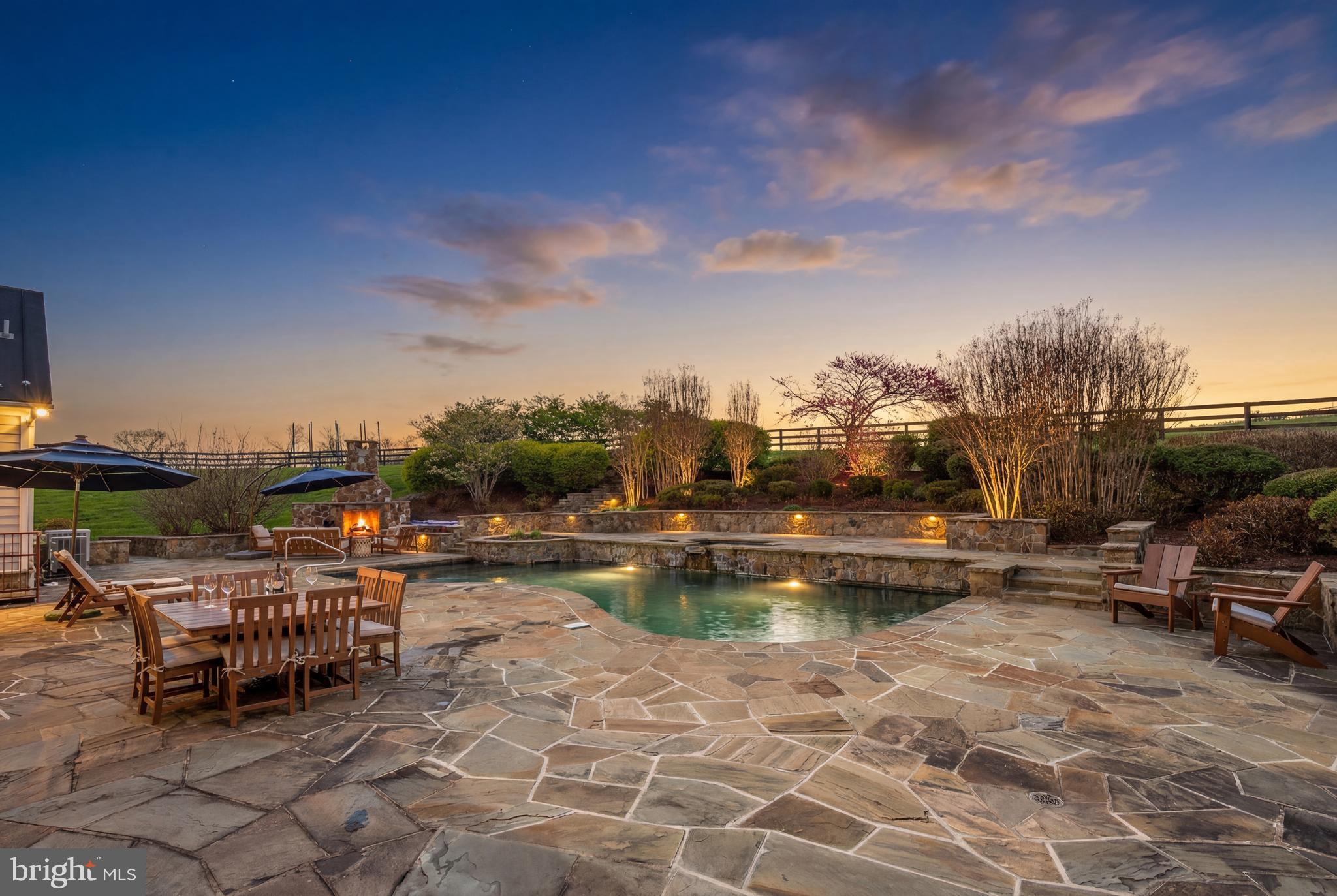 15718 Old Waterford Road Waterford, VA 20197 - Photo 5 of 81 a view of a swimming pool with lawn chairs