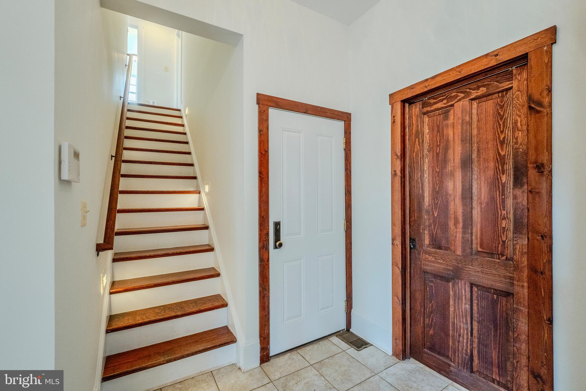15718 Old Waterford Road Waterford, VA 20197 - Photo 52 of 81 a view of a hallway with entryway wooden floor and front door