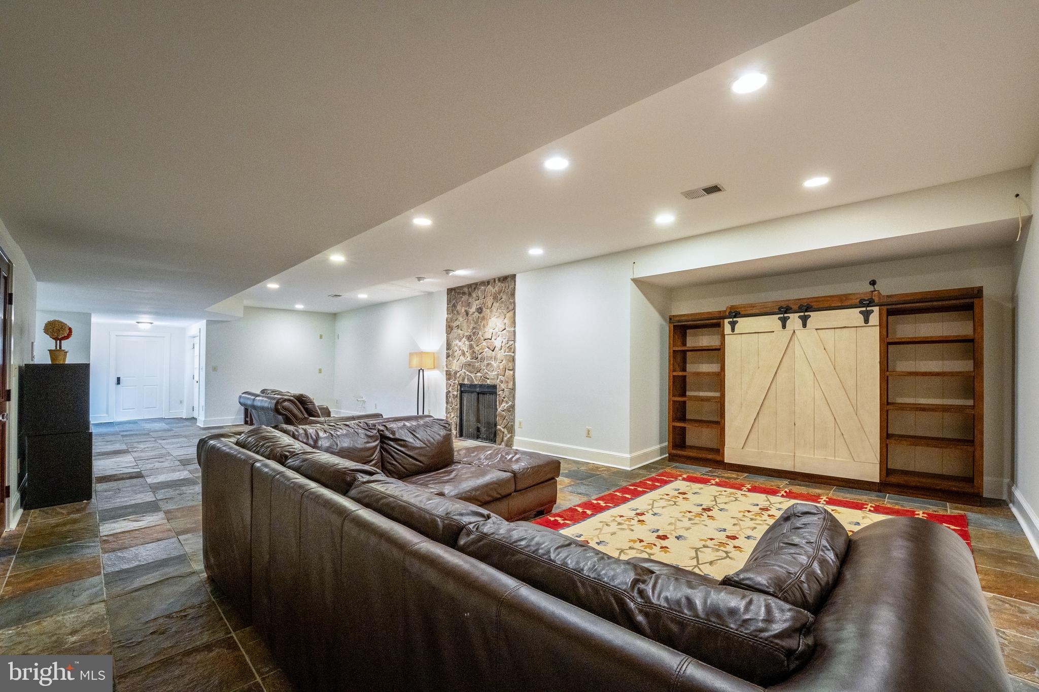 15718 Old Waterford Road Waterford, VA 20197 - Photo 58 of 81 a living room with furniture and a flat screen tv