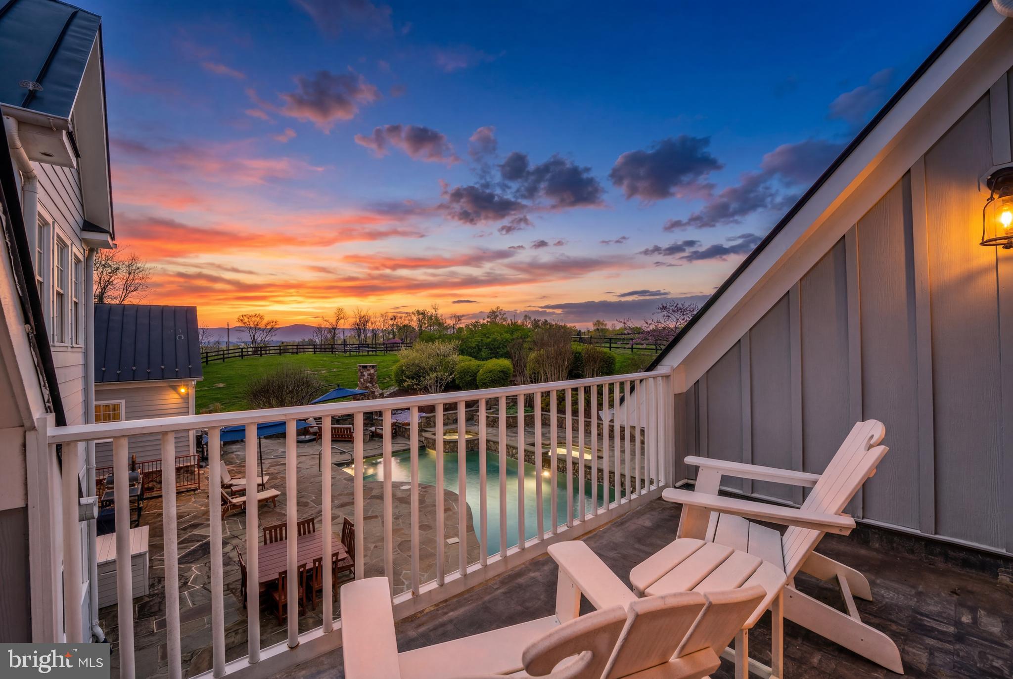 15718 Old Waterford Road Waterford, VA 20197 - Photo 6 of 81 a view of a chair and tables in the balcony