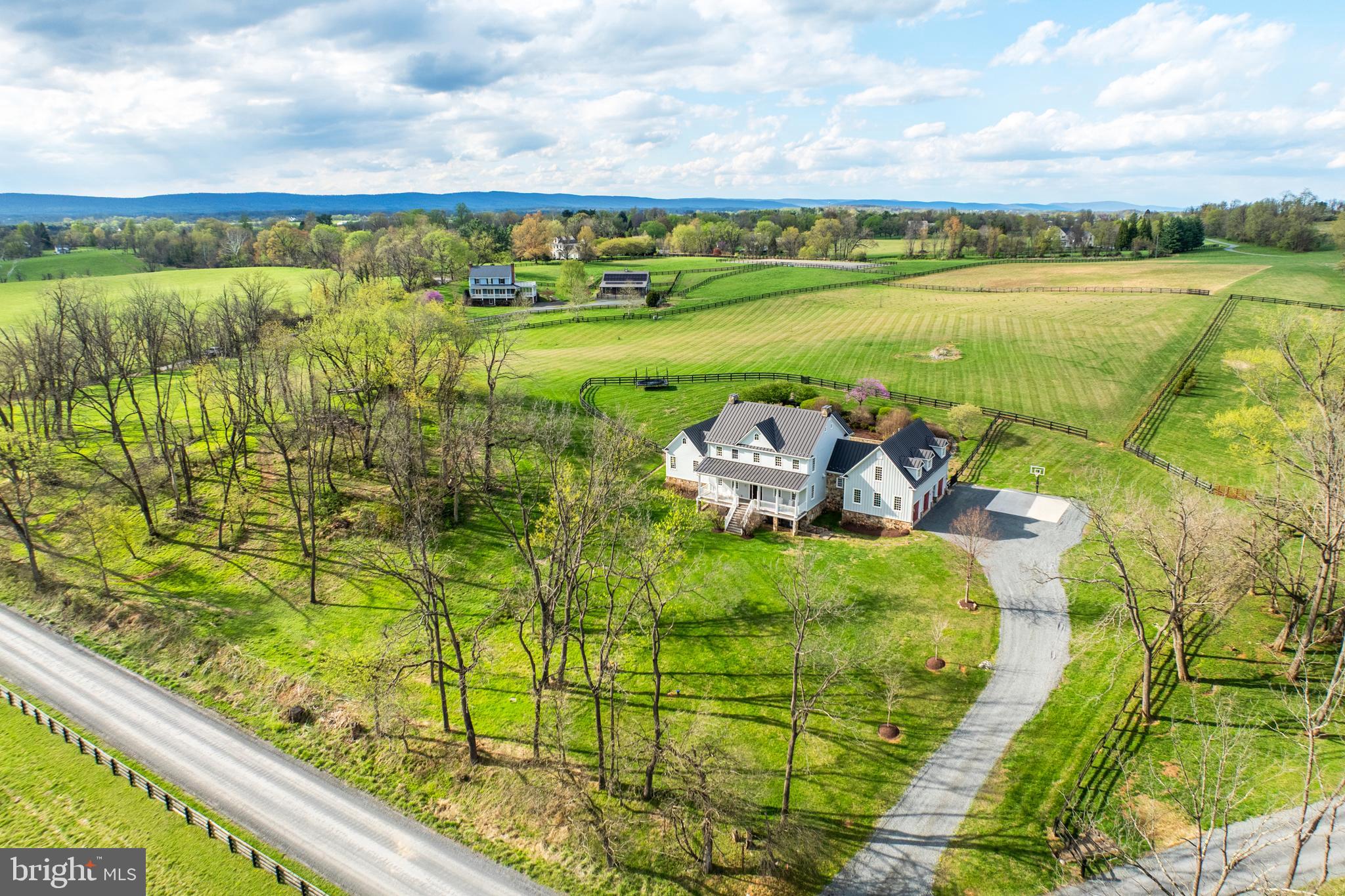 15718 Old Waterford Road Waterford, VA 20197 - Photo 73 of 81 a view of a lake with a building in the background