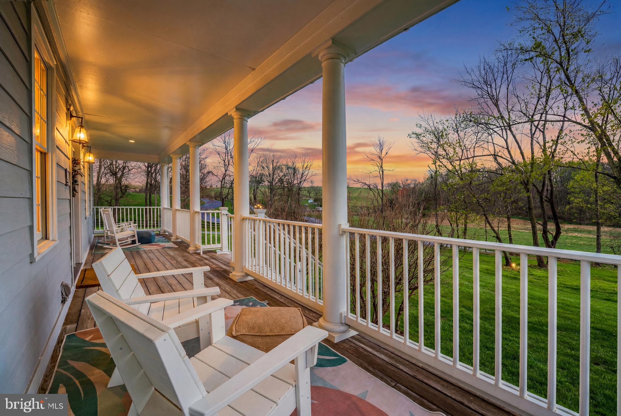 15718 Old Waterford Road Waterford, VA 20197 - Photo 8 of 81 a view of balcony with wooden floor and outdoor seating