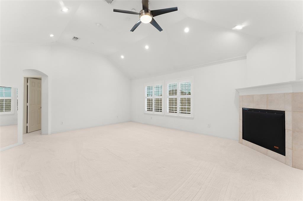 8108 Locust Street Irving, TX 75063 - Photo 17 of 39 a view of an empty room with a fireplace and a window