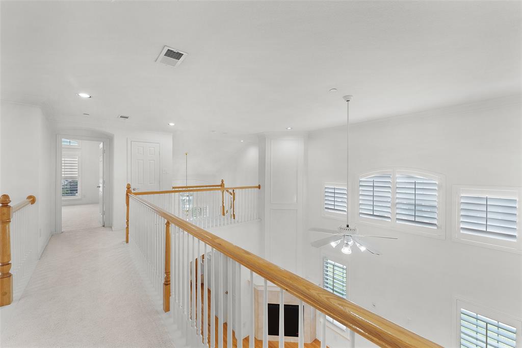 8108 Locust Street Irving, TX 75063 - Photo 26 of 39 a view of a hallway with stairs
