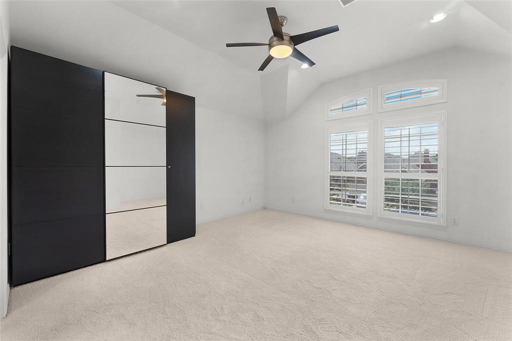 8108 Locust Street Irving, TX 75063 - Photo 29 of 39 en empty room with windows and fan