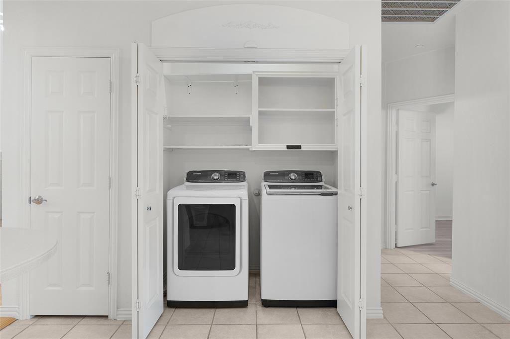 8108 Locust Street Irving, TX 75063 - Photo 33 of 39 a utility room with washer and dryer