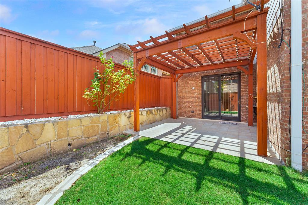 8108 Locust Street Irving, TX 75063 - Photo 37 of 39 a view of backyard with a barn and a yard
